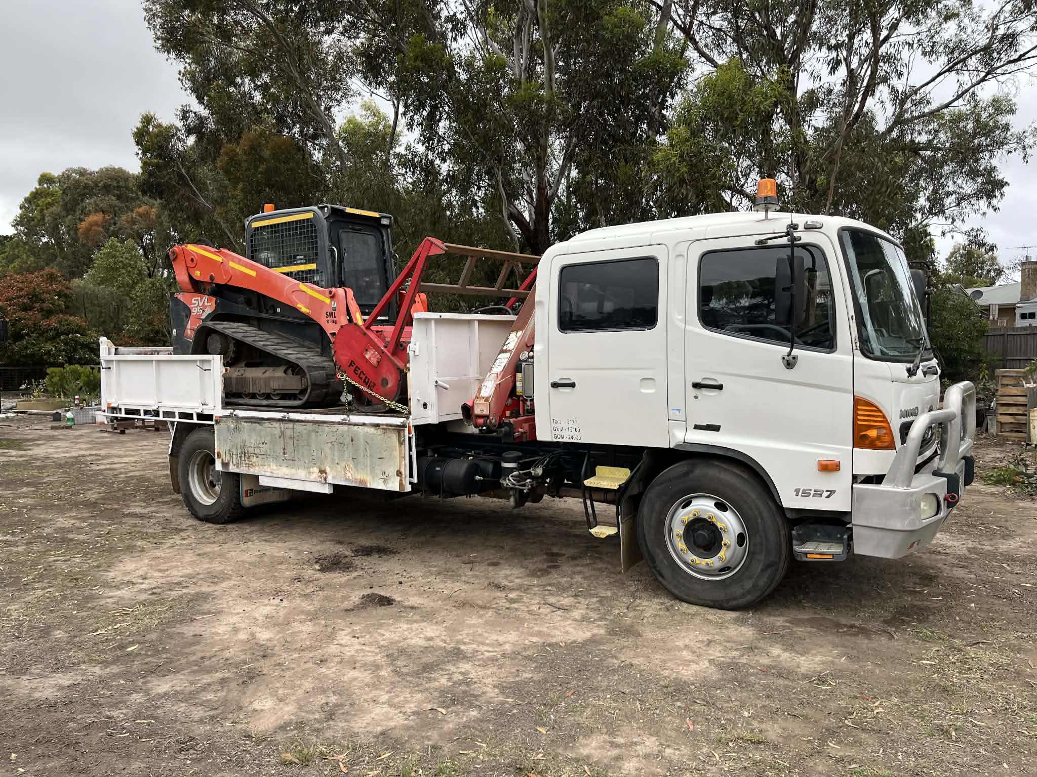 Kubota skid steer loaded on truck ready for job