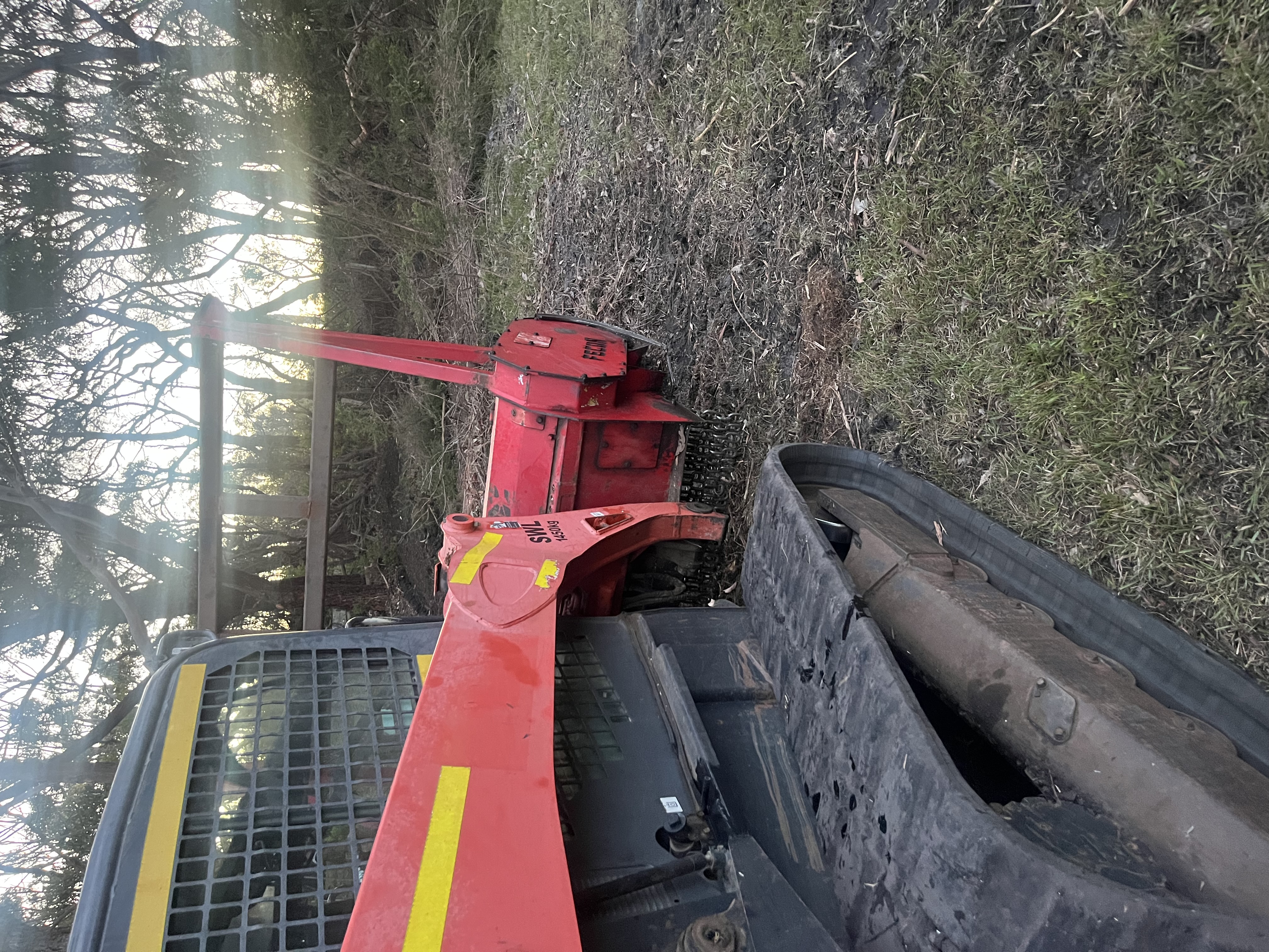 Forestry mulcher with Fecon attachment clearing vegetation in the Otways at dawn