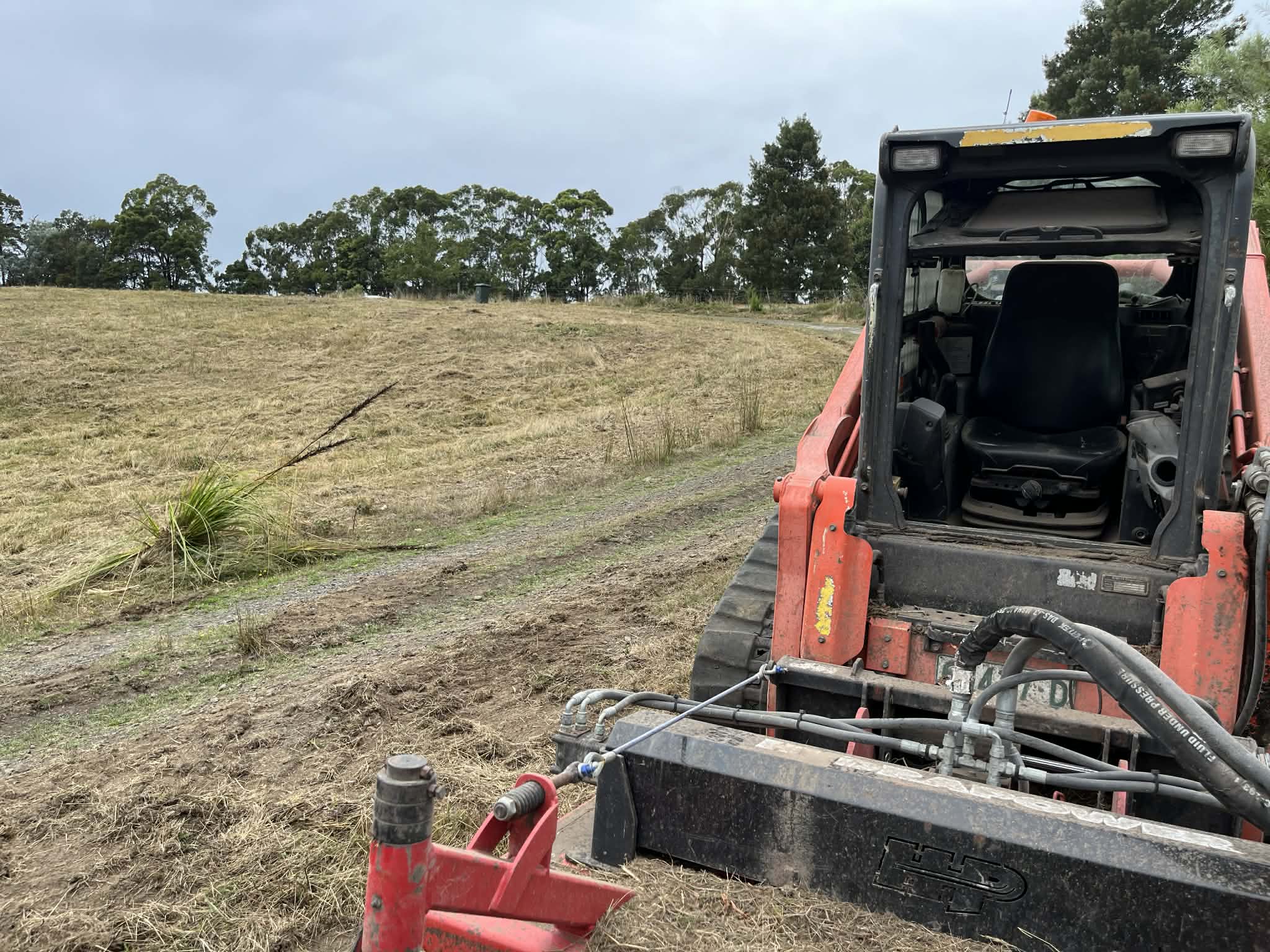 Kubota SVL95 compact track loader with Fecon forestry mulcher on job in Forrest, Victoria