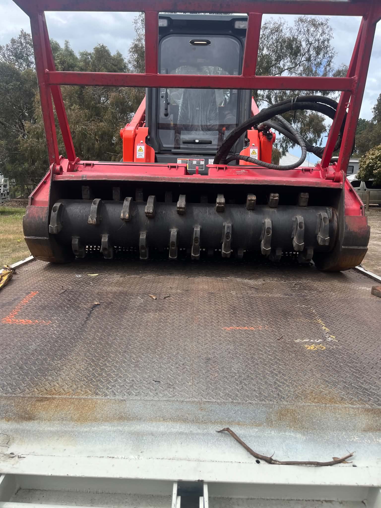 Close view of the Fecon mulcher head loaded on the truck